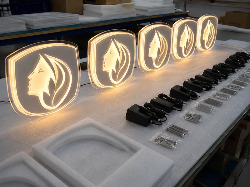 Matching acrylic LED logo signs prepared for a multi-store retail chain project