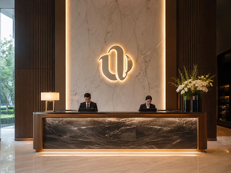 Hotel reception using custom backlit LED logo signs from China