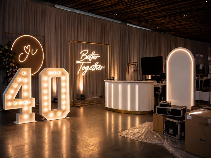 Event planner using custom LED signs for exhibitions weddings and photo areas