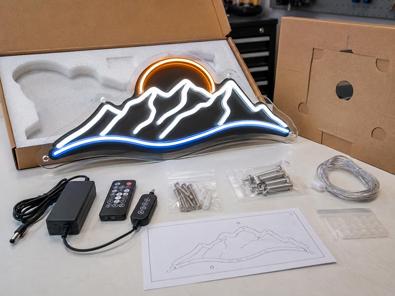Custom LED neon sign prepared with pre-drilled acrylic backing, power adapter, remote controller, screws, spacers, and installation accessories.