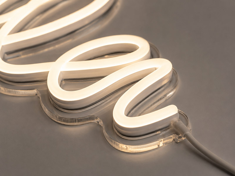 Close-up of clean silicone tubing and acrylic backing on a high quality LED neon sign