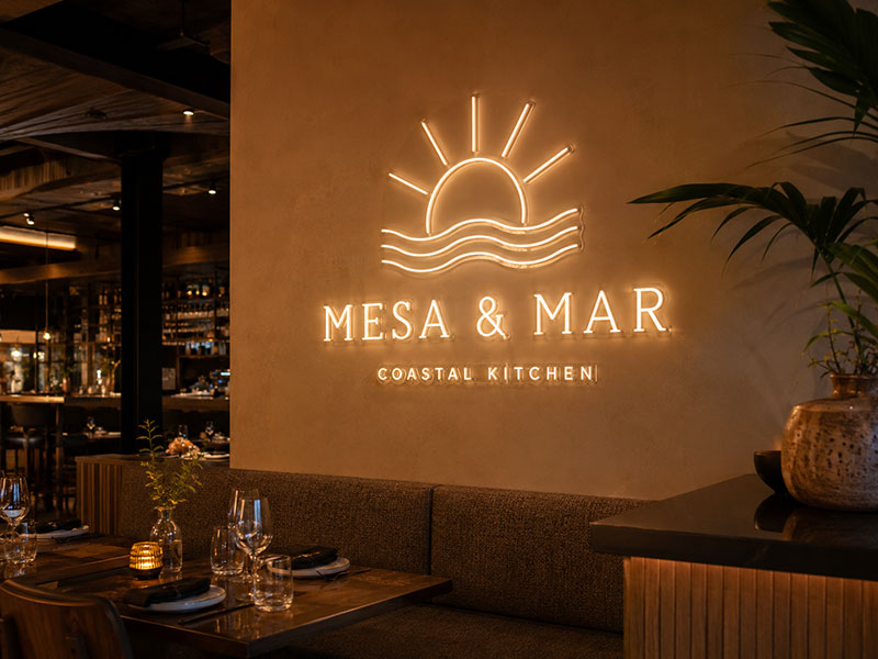 Custom LED neon logo sign for restaurant interior feature wall