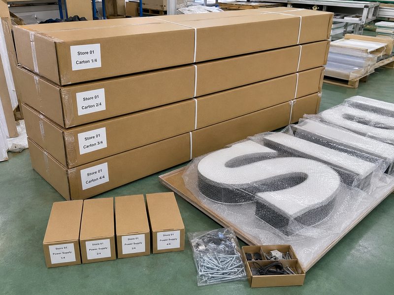 Blind shipping custom signs with store-coded cartons for direct project delivery