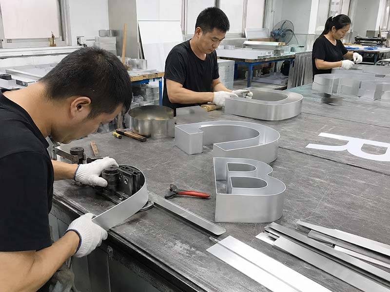 Channel letter fabrication with metal return forming and acrylic cutting