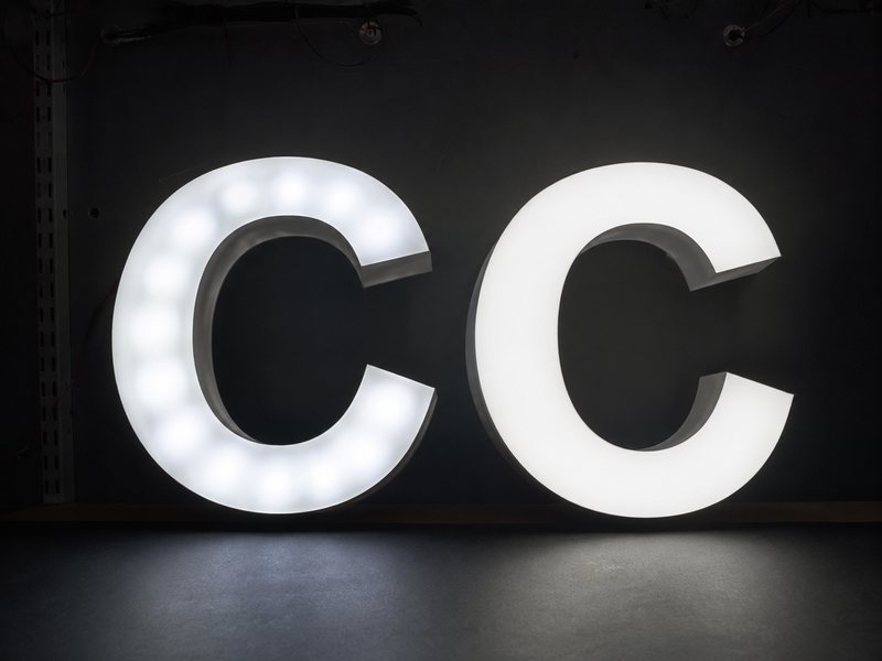 Comparison of shallow and properly engineered channel letters showing different lighting uniformity