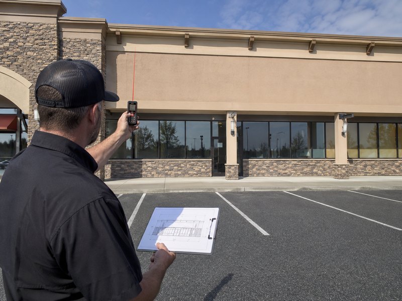 Accurate storefront site survey using a laser meter for channel letter installation