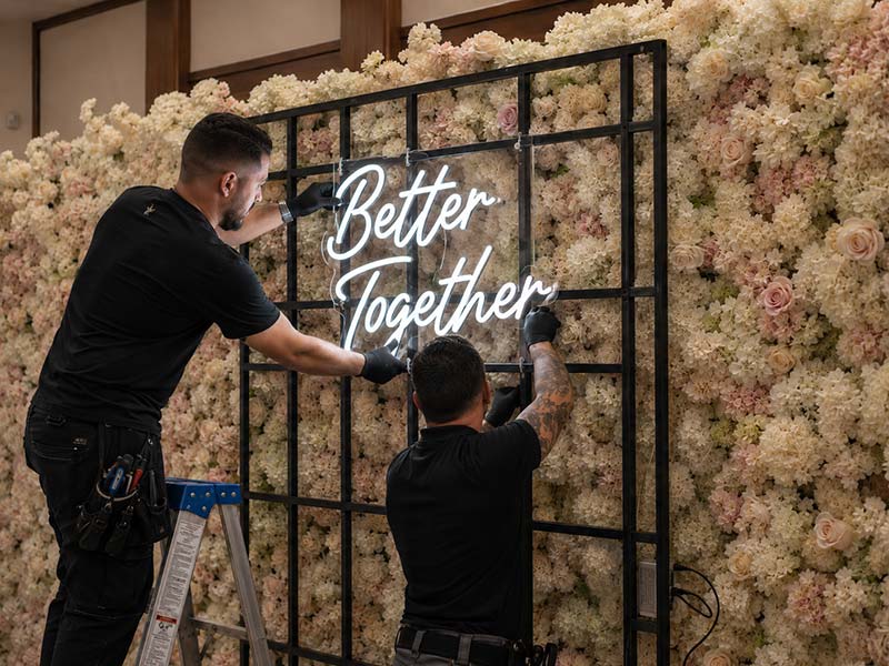 Installing an LED neon sign securely on a framed event backdrop
