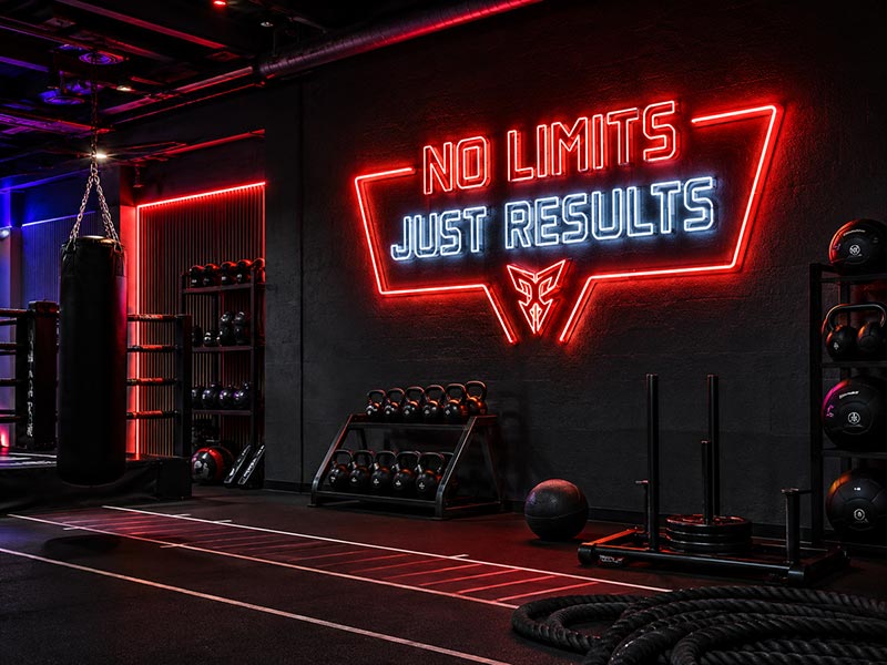 LED logo sign creating a high-energy gym training atmosphere