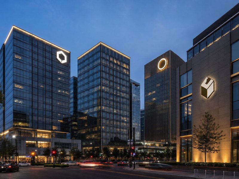 Front-lit, halo-lit, rooftop and illuminated high-rise building sign types on commercial towers