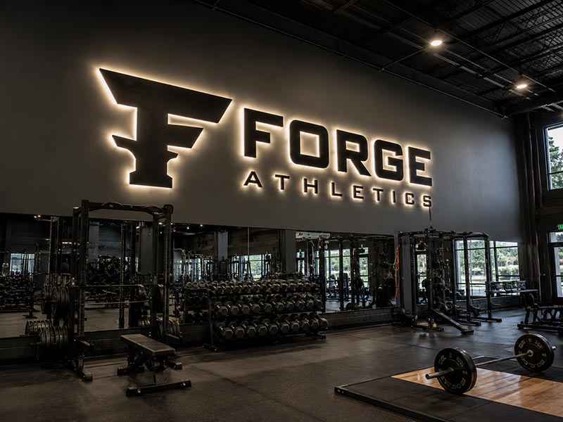 Large LED gym logo wall sign sized for an open fitness space