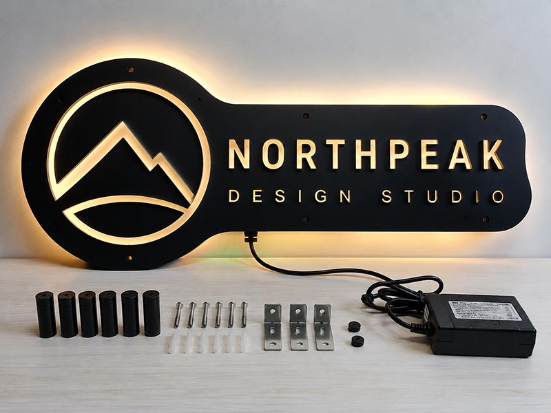Custom LED sign with mounting accessories and power components prepared for installation