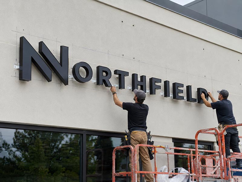 LED sign being mounted with brackets or on-site installation