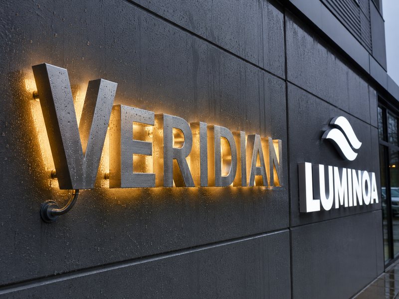 Outdoor stainless steel and coated aluminum channel letters on a commercial storefront