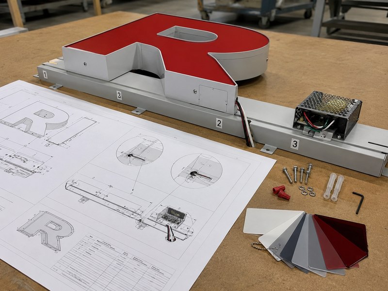 Raceway-mounted channel letter shop drawing with mounting and electrical details