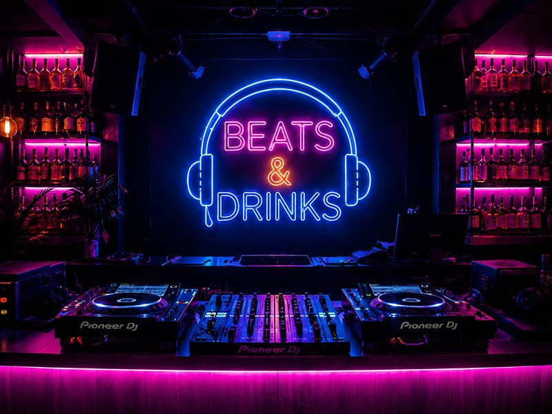 RGB neon wall sign creating atmosphere inside a bar
