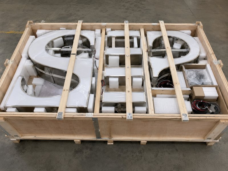 Segmented channel letter sections protected in reinforced export packaging