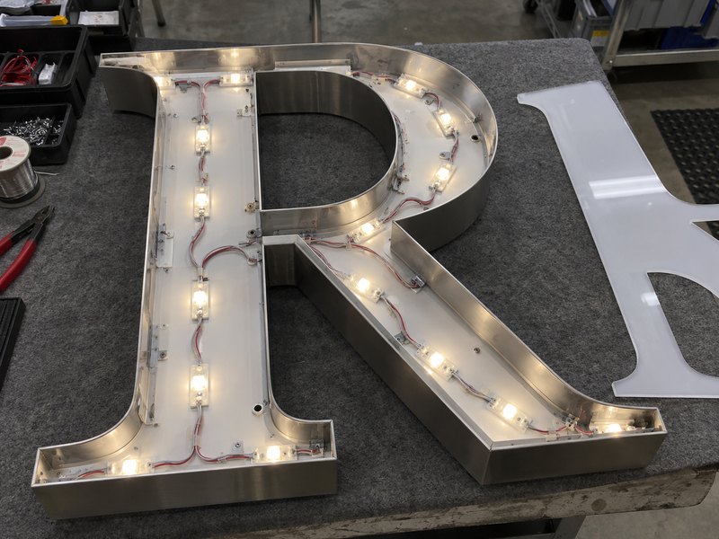 LED layout inside a serif channel letter with wide strokes and narrow terminals