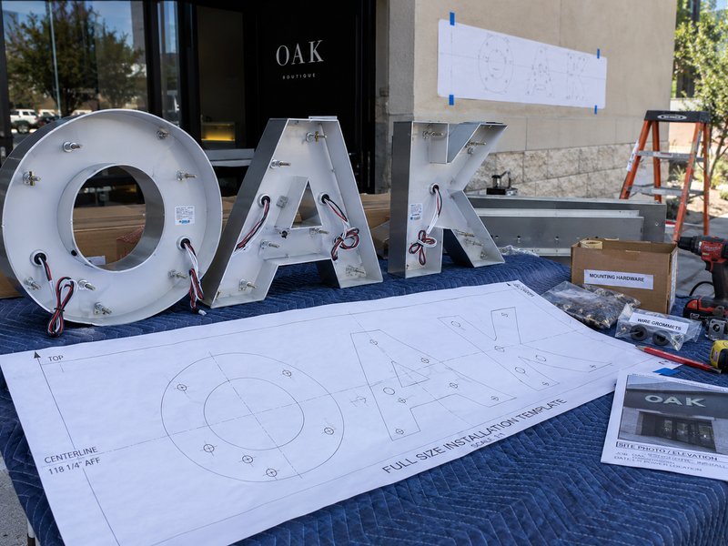 Sign mounting holes, wire exits, installation template and site conditions prepared for installation