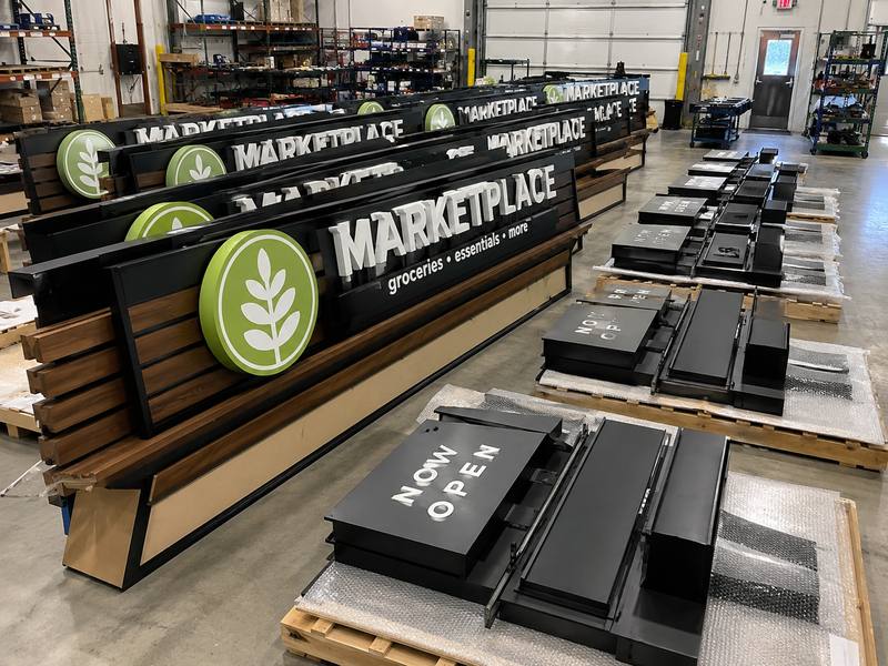 Multiple custom sign sets showing production capacity, repeatability, and multi-location project capability